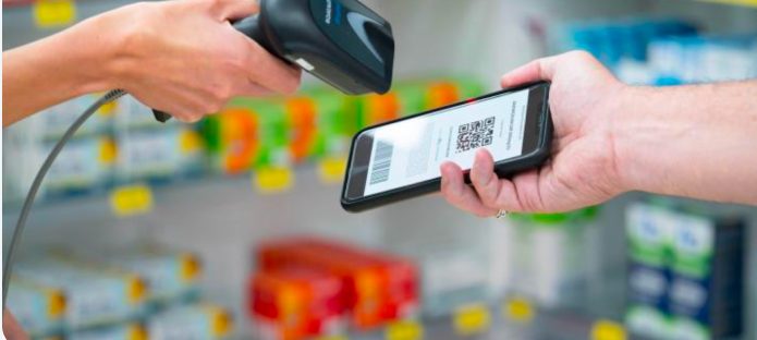 A pharmacist scanning an electronic prescription