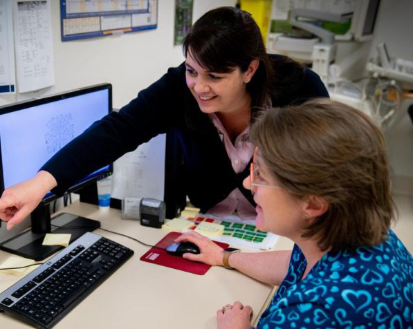 Healthcare staff training at a computer